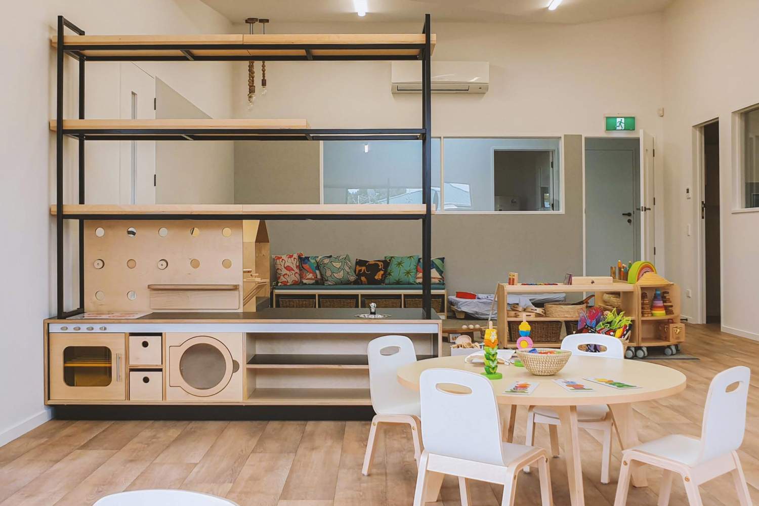 wood and steel roll play Hub with open shelving for Schools